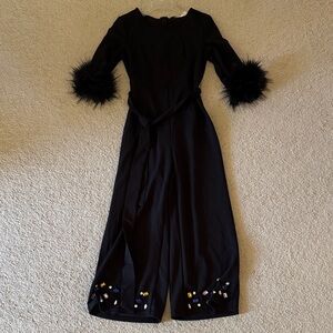 Black Jumpsuit with Feather Cuffs and Embellished Hem